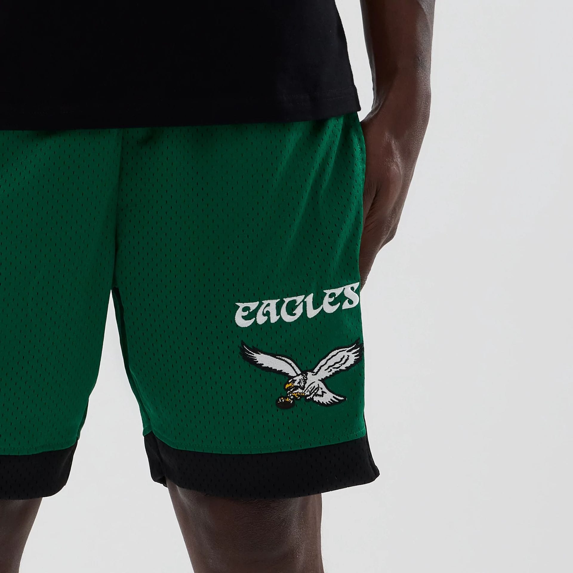 The model is wearing these NFL Philadelphia Eagles Mesh Shorts in green. 5