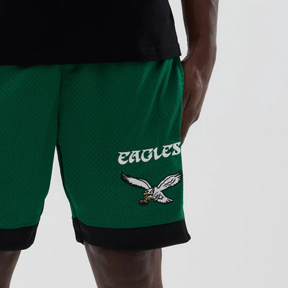 The model is wearing these NFL Philadelphia Eagles Mesh Shorts in green. 5
