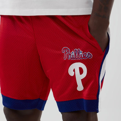 The model is wearing these MLB Philadelphia Phillies Mesh Shorts in red. 3