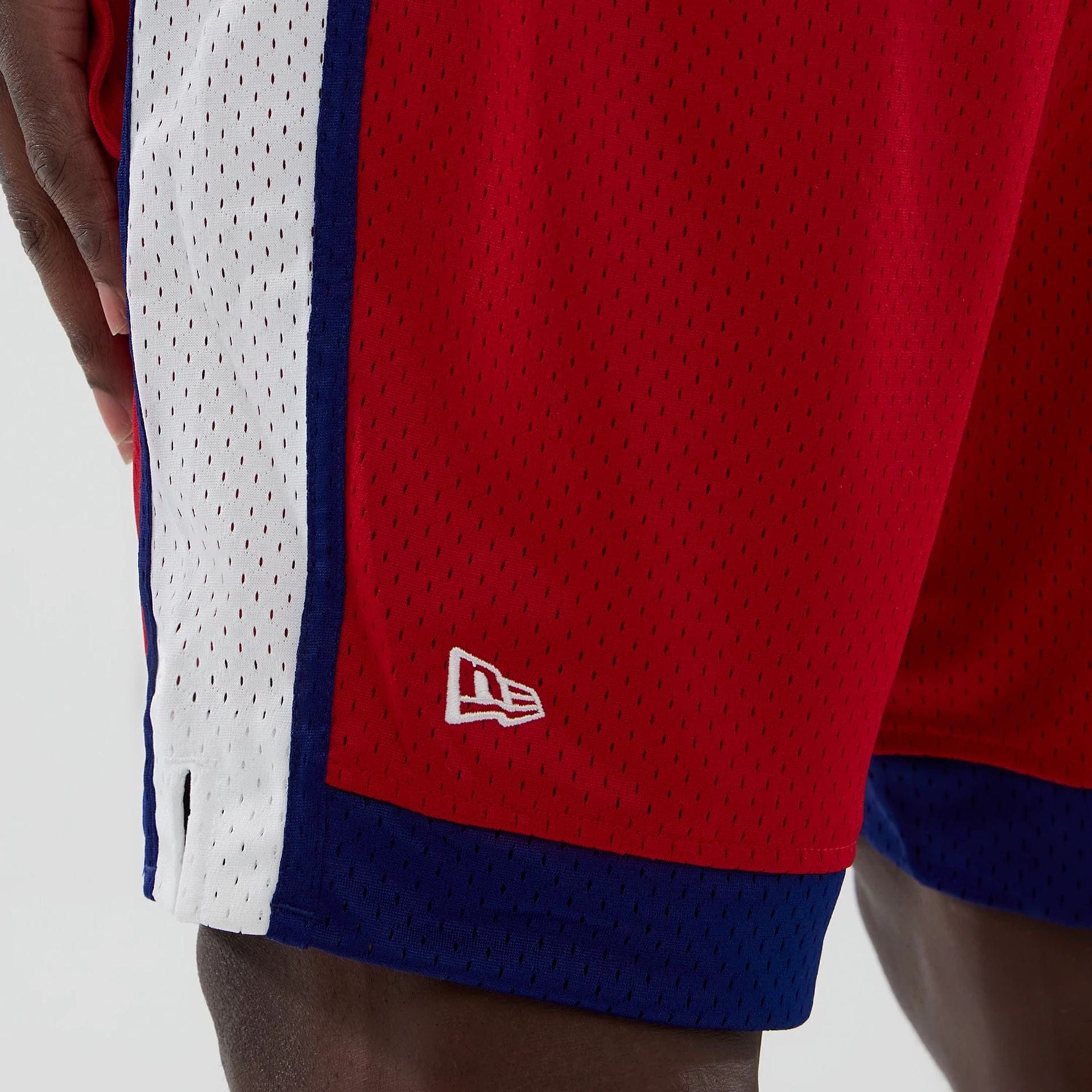 The model is wearing these MLB Philadelphia Phillies Mesh Shorts in red. 4