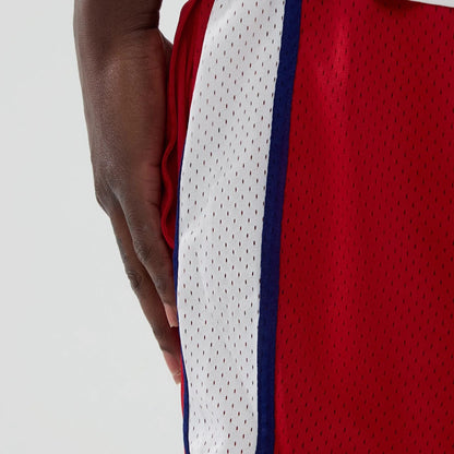 The model is wearing these MLB Philadelphia Phillies Mesh Shorts in red. 5