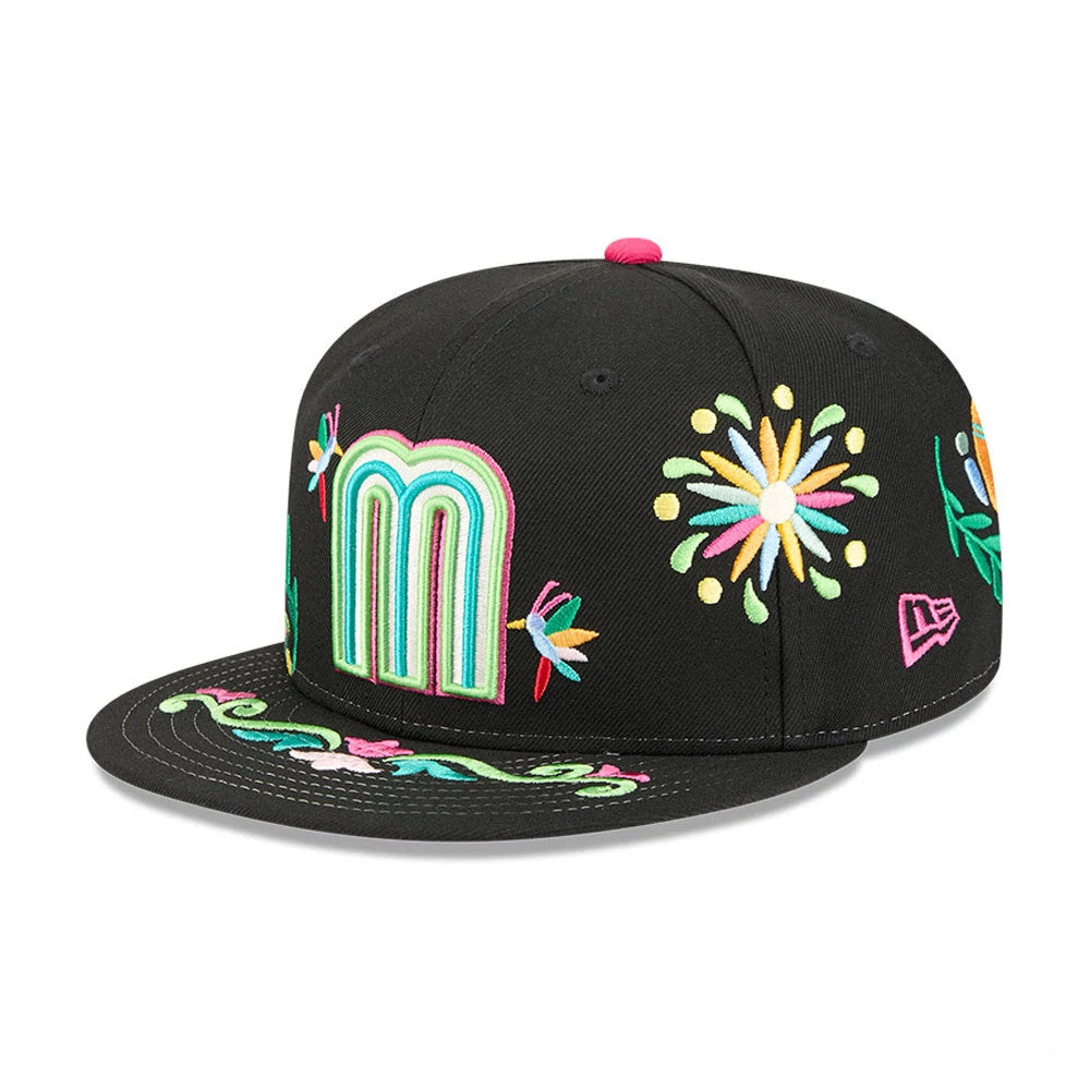 Mexico WBC Latin Embroidery Black New Era 59FIFTY Fitted Cap, three-quarter view showing a large colourful M logo with intricate floral embroidery on the front panel, designs on the visor and New Era flag logo on the left side.