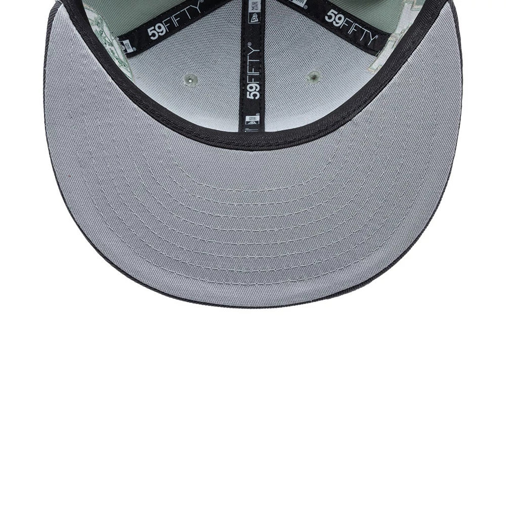 Pumas Unam Liga MX Pastel Green New Era 59FIFTY Fitted Cap, inside view showing the black 59FIFTY branded taping, grey undervisor and black sweatband, with a focus on the detailed stitching beneath the visor.