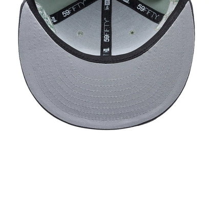 Pumas Unam Liga MX Pastel Green New Era 59FIFTY Fitted Cap, inside view showing the black 59FIFTY branded taping, grey undervisor and black sweatband, with a focus on the detailed stitching beneath the visor.