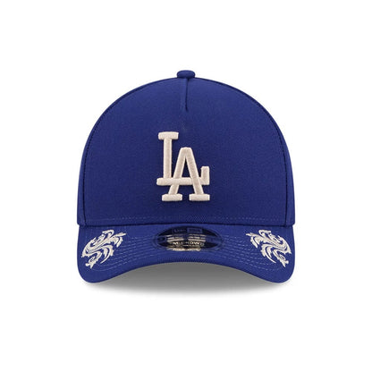 Pictured is this MLB Script LA Dodgers 9FORTY M-Crown A-Frame Adjustable cap in dark blue. 3