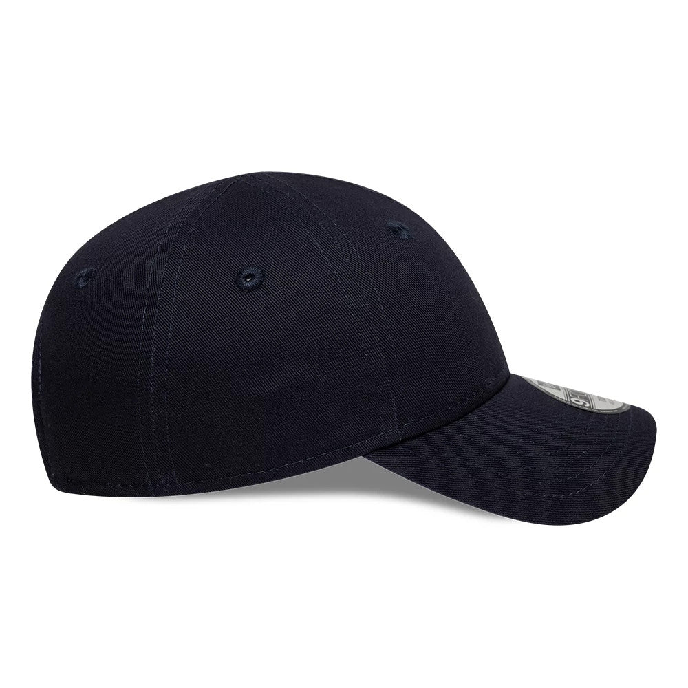 Red Bull Racing Toddler Navy New Era 9FORTY Adjustable Cap, side view with a slightly curved visor, showcasing a structured crown with navy eyelets and a 9FORTY size sticker on the visor.