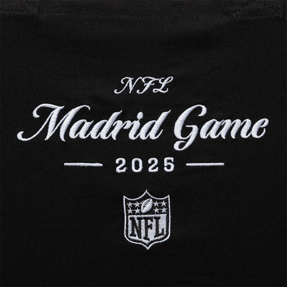 New Era Shield Logo NFL Madrid Game 2025 Black Tote Bag, front view showing embroidered white lettering stating NFL Madrid Game 2025 above an NFL shield logo on the centre of the black fabric.