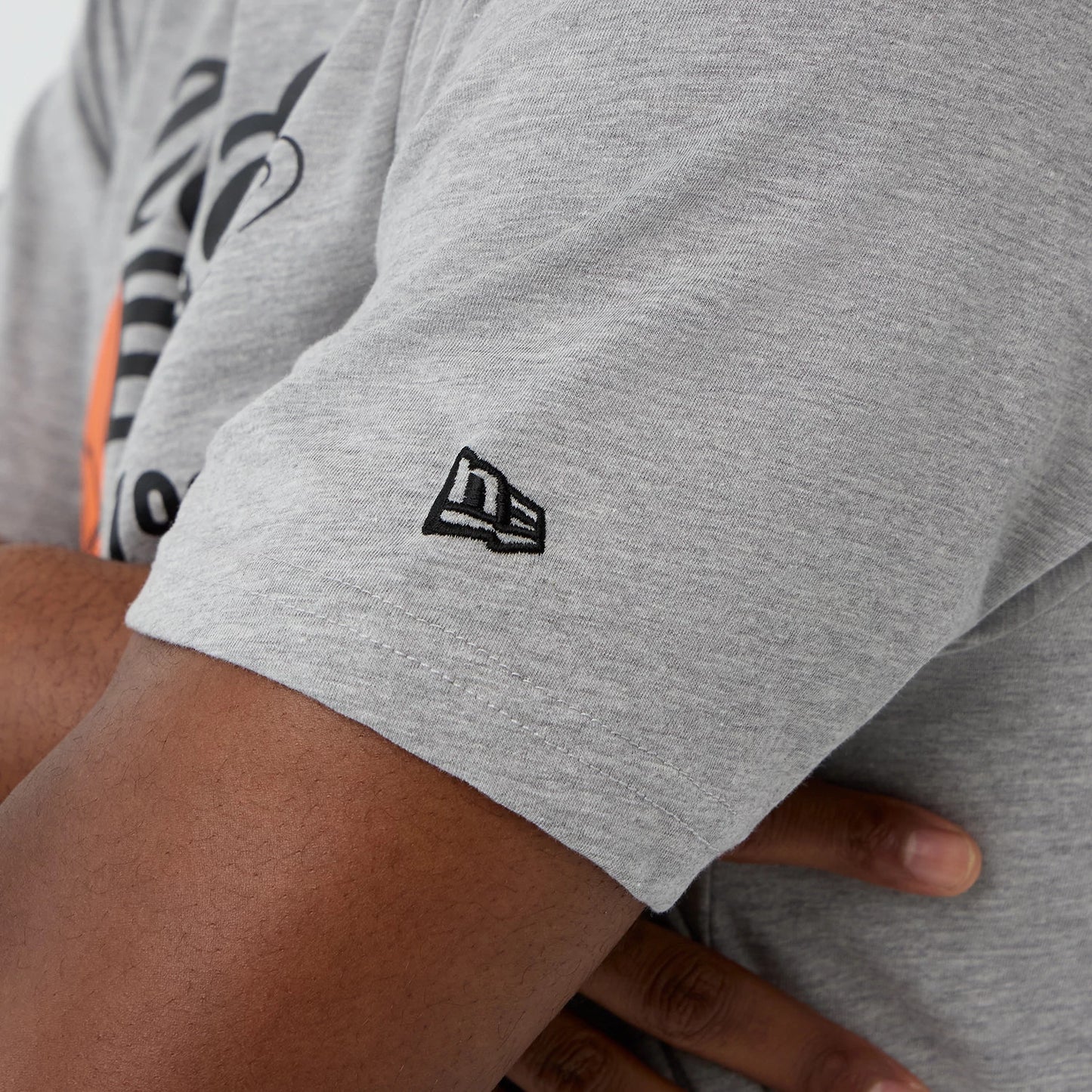 The Male model is wearing  New Era Back To School Grey T-Shirt 5