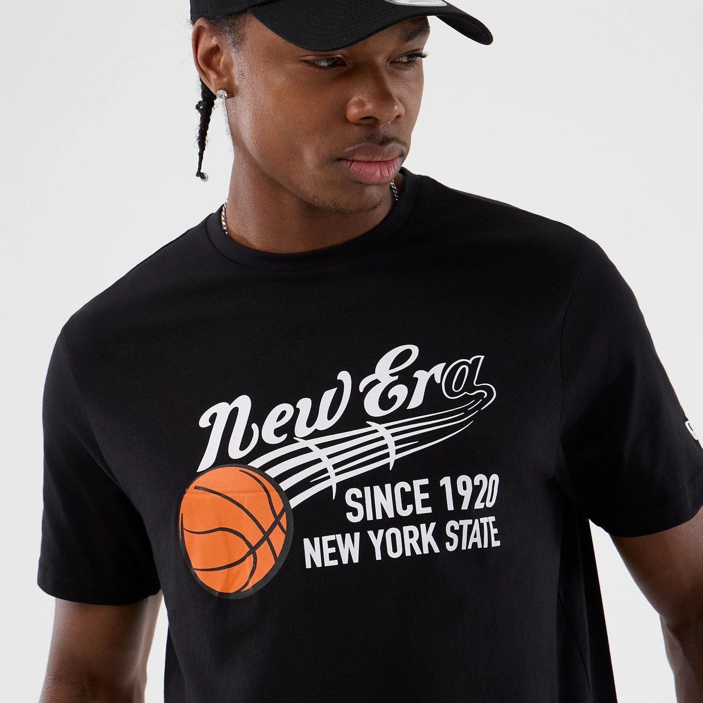 The Male model is wearing  New Era Back To School Black T-Shirt  6