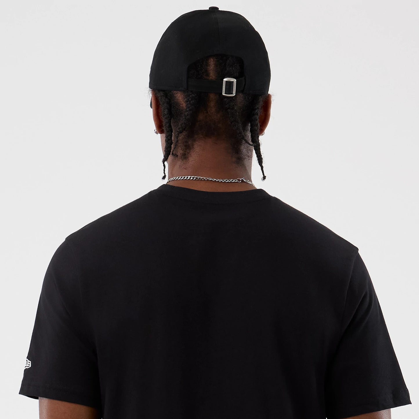 The Male model is wearing  New Era Back To School Black T-Shirt 7