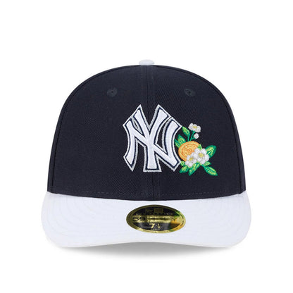 Yankees MLB Spring Training 2026 Navy Low Profile New Era 59FIFTY Fitted Cap, front view showing white raised embroidered NY logo with floral detail, white curved visor, and a gold 59FIFTY size sticker on the visor.