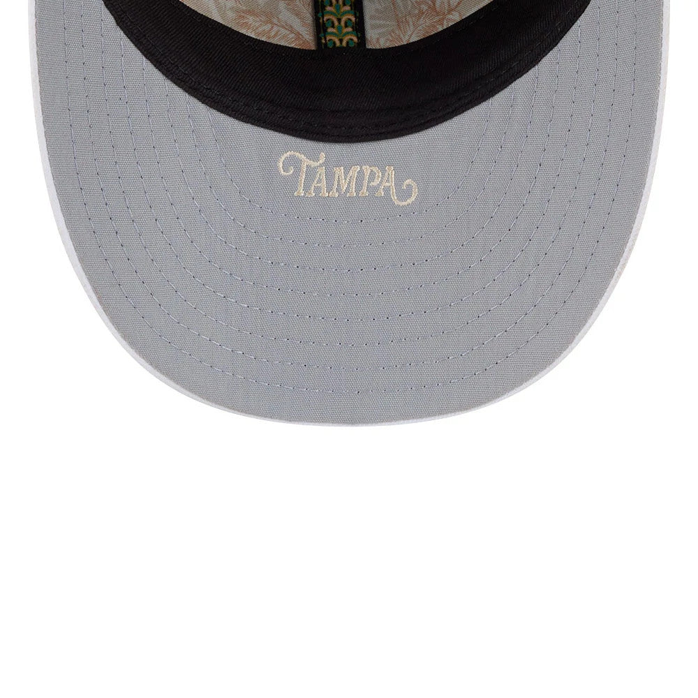 Yankees MLB Spring Training 2026 Navy Low Profile New Era 59FIFTY Fitted Cap, inside view showing grey undervisor with Tampa embroidered in cream, featuring a floral-patterned taping and black sweatband.