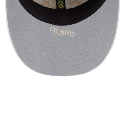 Yankees MLB Spring Training 2026 Navy Low Profile New Era 59FIFTY Fitted Cap, inside view showing grey undervisor with Tampa embroidered in cream, featuring a floral-patterned taping and black sweatband.