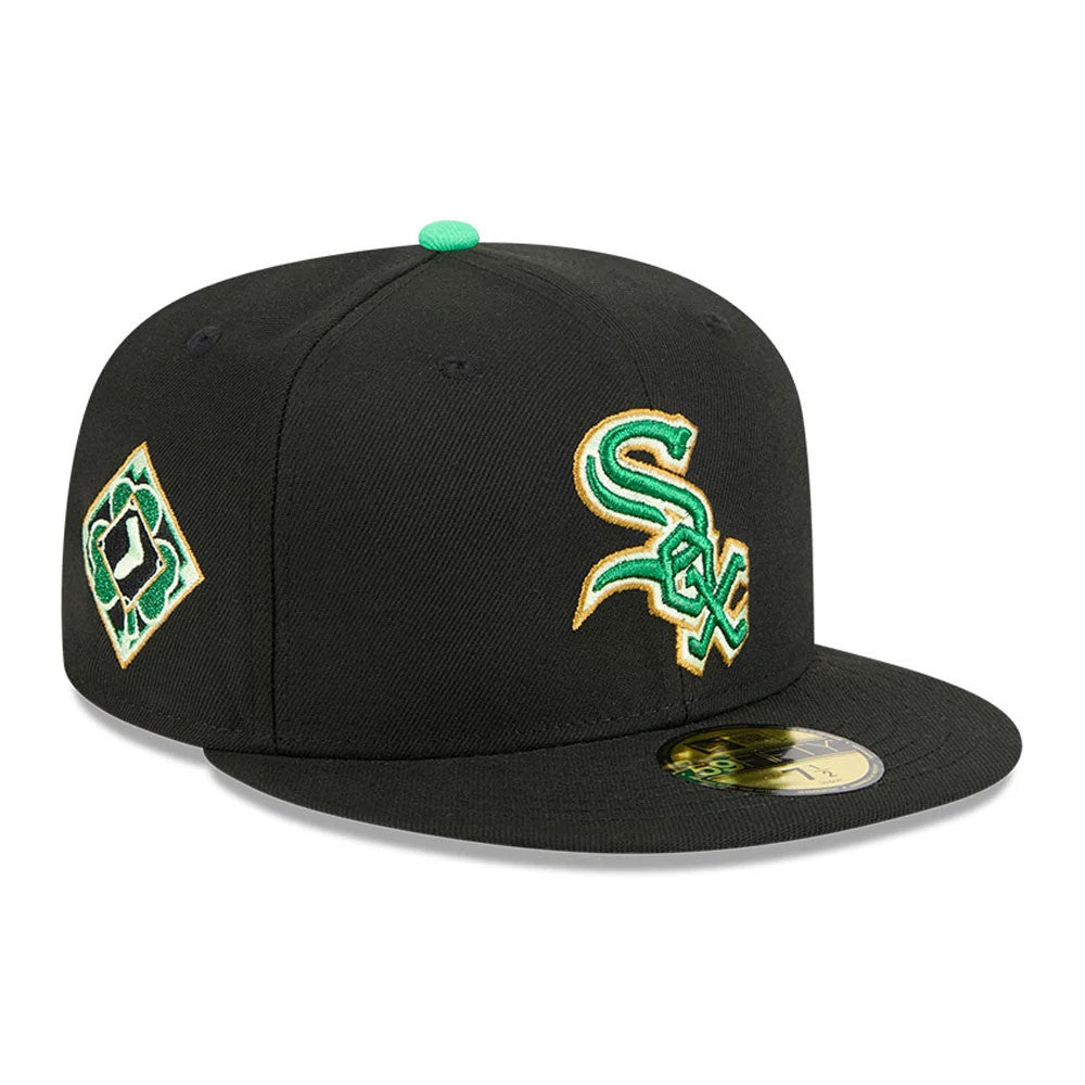 Chicago White Sox MLB Saint Patrick's Day Black New Era 59FIFTY Fitted Cap, three-quarter view showing the green and gold embroidered Sox logo on the front panel, with a matching shamrock motif on the left side.
