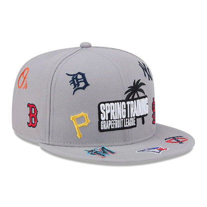 Pictured is this MLB Scattered Grapefruit League Logo 9FIFTY Snapback cap in grey. 3