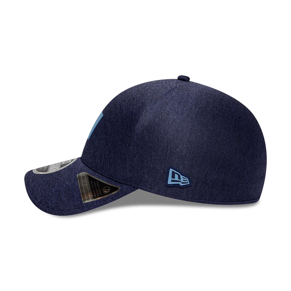 Tampa Bay Rays MLB Clubhouse Navy New Era 39THIRTY Infinity Stretch Fit Cap, side view showing the light blue embroidered New Era flag logo on the left side, with a curved navy visor and a sticker on the top.