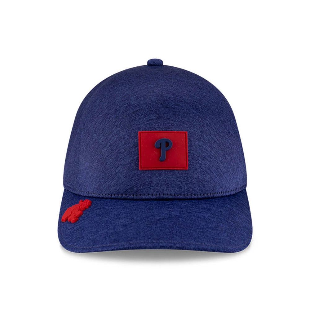 Philadelphia Phillies MLB Clubhouse Red New Era 39THIRTY Infinity Stretch Fit Cap, front view showing a red and blue Phillies logo centred on the structured blue crown and a red embroidered bear logo on the left side of the visor.