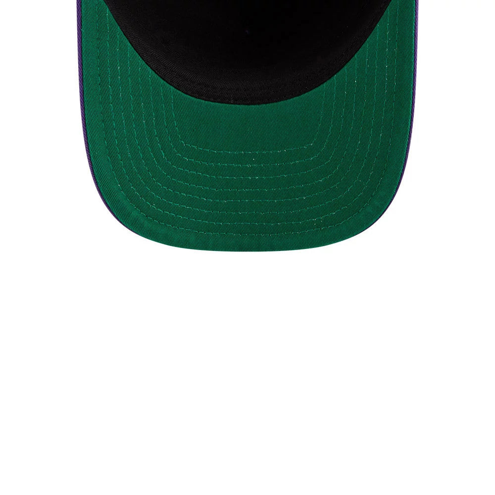LA Lakers NBA Historic Purple New Era 9FIFTY A-Frame Snapback Adjustable Cap, inside view showing a green undervisor seamlessly attached to the black sweatband with parallel stitching, highlighting its structured A-frame design.