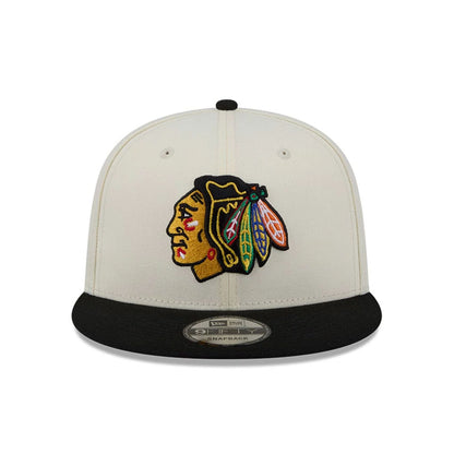 Pictured is this NHL Localized Chicago Blackhawks 9FIFTY Snapback cap in white. 3