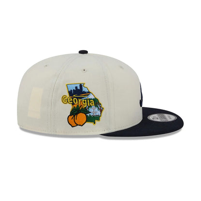 Pictured is this MLB Localized Atlanta Braves 9FIFTY Snapback cap in white. 5