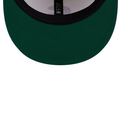 Chicago Cubs MLB Localized White New Era 9FIFTY Snapback Adjustable Cap, inside view showing a dark green undervisor, black sweatband, and black taping with 9FIFTY lettering, against a white interior crown.