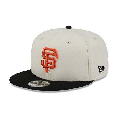San Francisco Giants MLB Localized White New Era 9FIFTY Snapback Adjustable Cap, front view showing the raised orange embroidered SF logo on the white crown, with a black flat visor and a 9FIFTY size sticker.