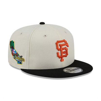 San Francisco Giants MLB Localized White New Era 9FIFTY Snapback Adjustable Cap, three-quarter view showing the orange embroidered SF logo on the white front panel, a colourful California patch on the right side.