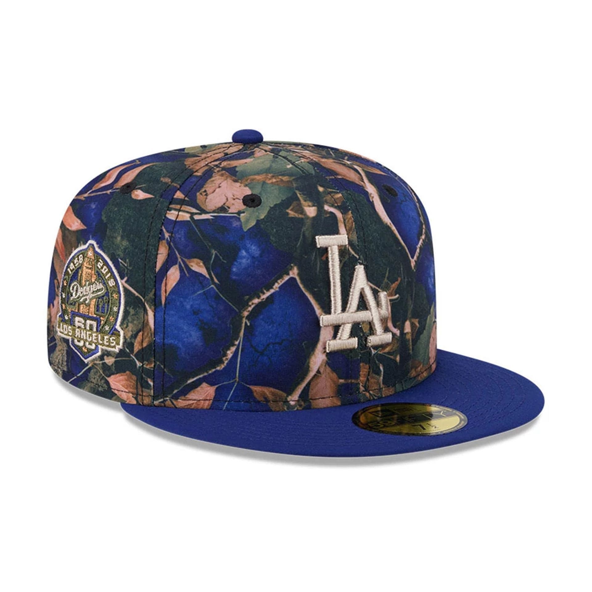 Pictured is this MLB Leaves LA Dodgers 59FIFTY Fitted cap in dark blue. 1