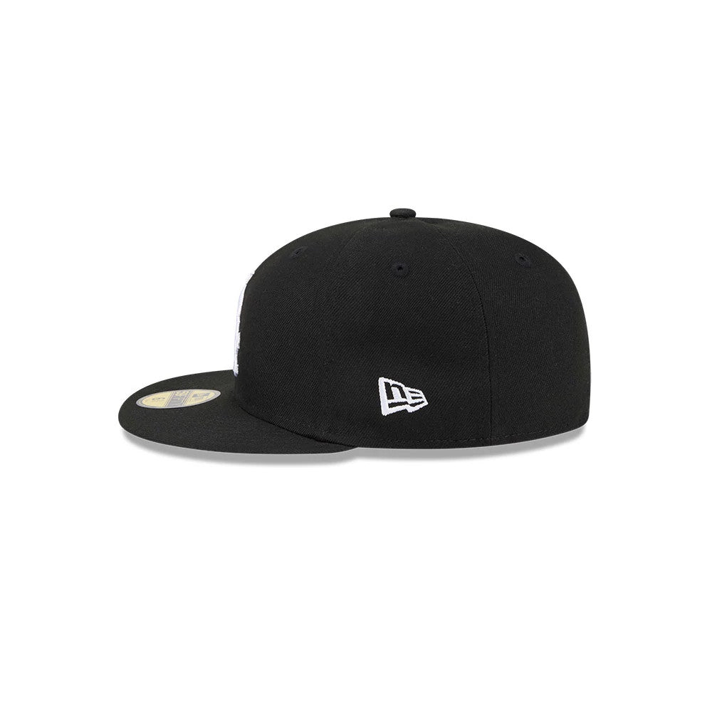 Chicago White Sox MLB Hidden Hit Black New Era 59FIFTY Fitted Cap, side view showing the white embroidered New Era flag logo on the left side of the structured black crown and a gold 59FIFTY size sticker on the black visor.