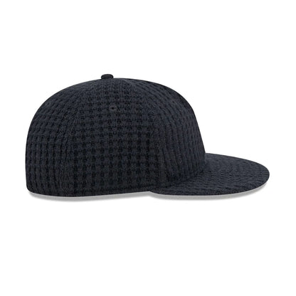 This is a  New Era Waffle Knit Navy Retro Crown 9FIFTY Adjustable Cap 7