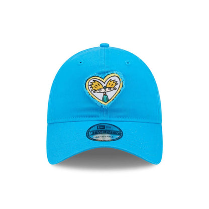 Hey Arnold Heart Blue New Era 9TWENTY Adjustable Cap, front view showing the embroidered heart-shaped graphic of Hey Arnold's face on the structured blue crown, with a curved visor and a 9TWENTY size sticker.