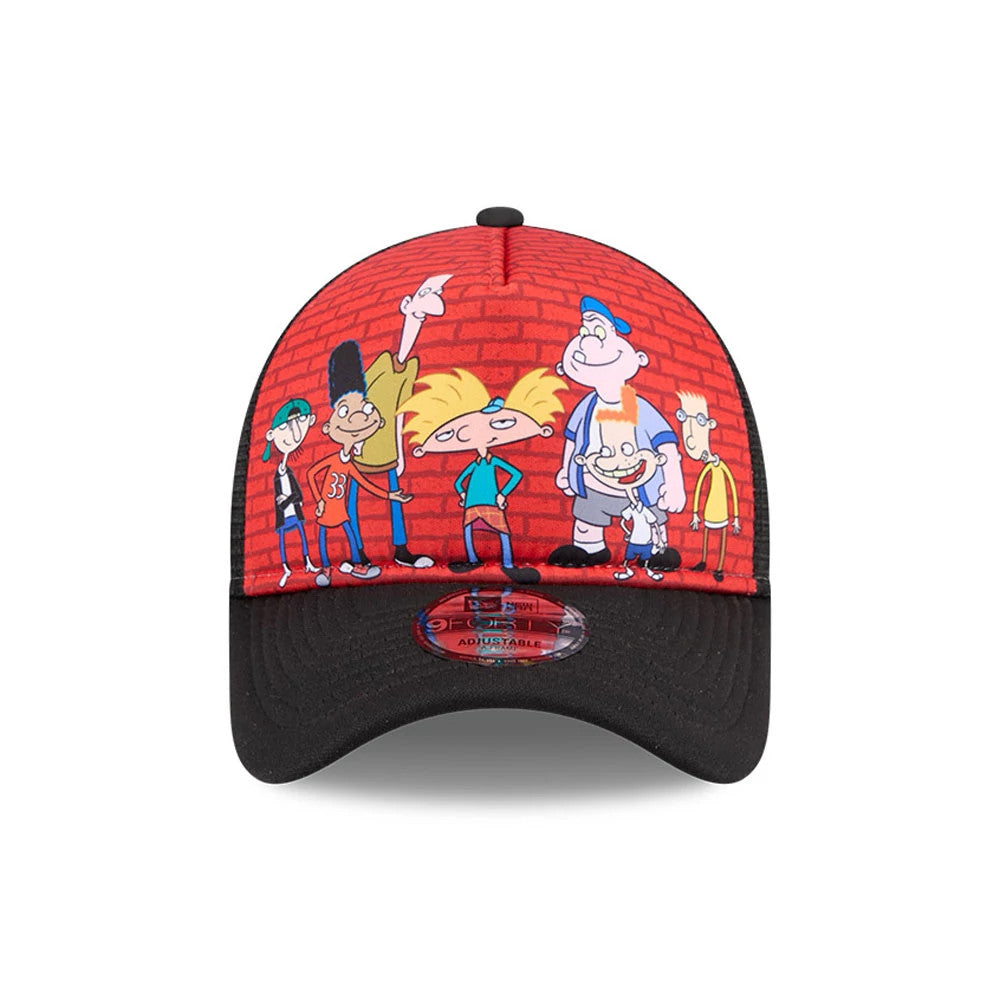 Hey Arnold Graphic Black New Era 9FORTY A-Frame Trucker Adjustable Cap, front view showing colourful cartoon characters against a red brick wall graphic on the structured crown, with a black curved visor featuring a 9FORTY size sticker.