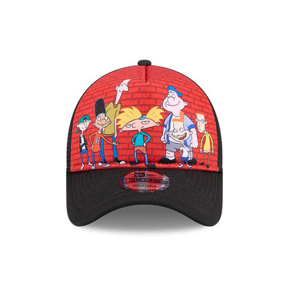 Hey Arnold Graphic Black New Era 9FORTY A-Frame Trucker Adjustable Cap, front view showing colourful cartoon characters against a red brick wall graphic on the structured crown, with a black curved visor featuring a 9FORTY size sticker.