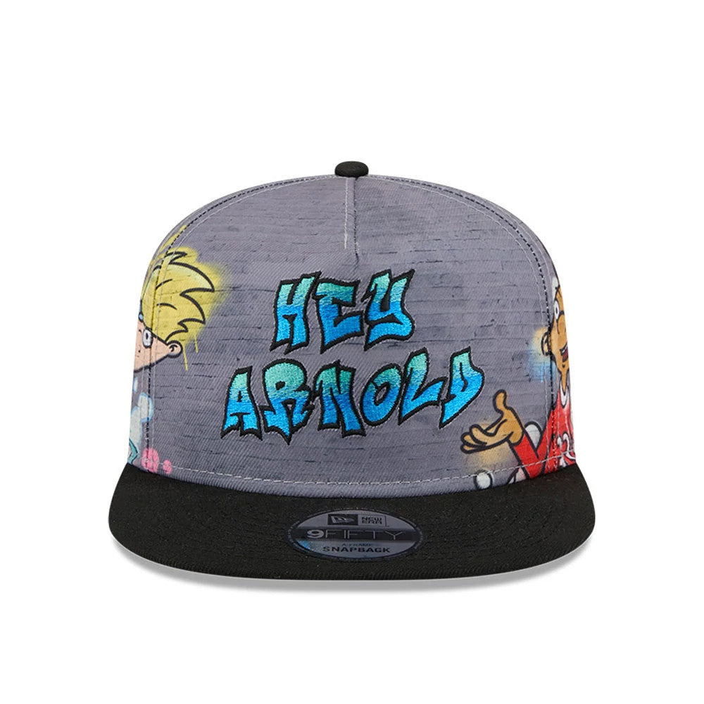 Hey Arnold Graffiti Grey New Era 9FIFTY A-Frame Snapback Adjustable Cap, front view featuring blue graffiti-style Hey Arnold lettering on the grey crown with characters on either side, and a black flat visor with a 9FIFTY size sticker.