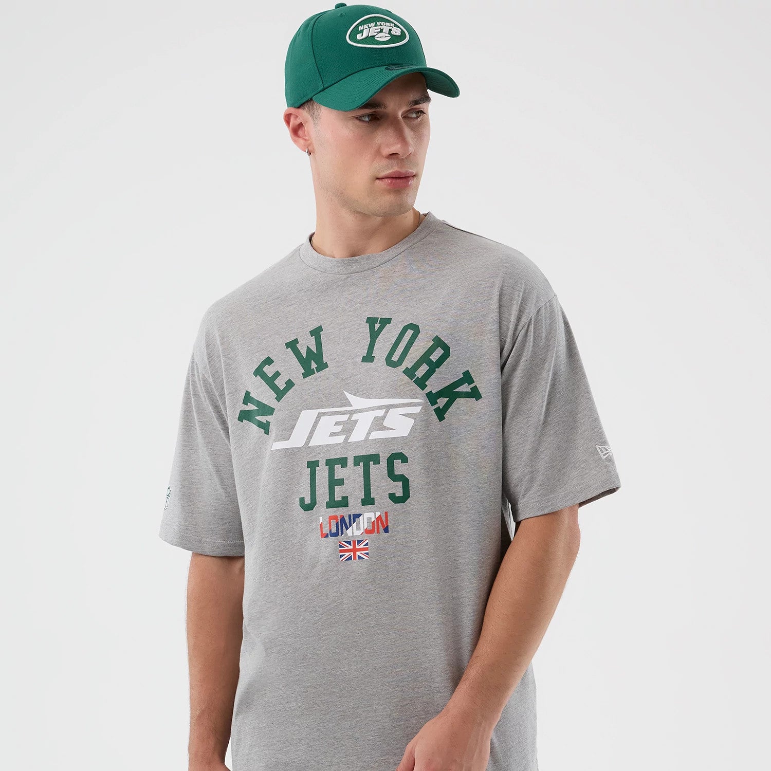 The Male model is wearing New York Jets NFL International Series Games Grey Oversized T-Shirt 7