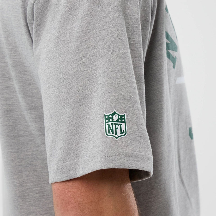 The Male model is wearing New York Jets NFL International Series Games Grey Oversized T-Shirt  6