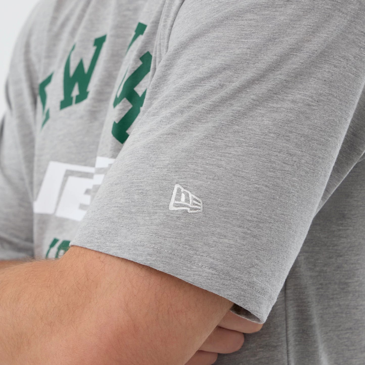 The Male model is wearing New York Jets NFL International Series Games Grey Oversized T-Shirt 5