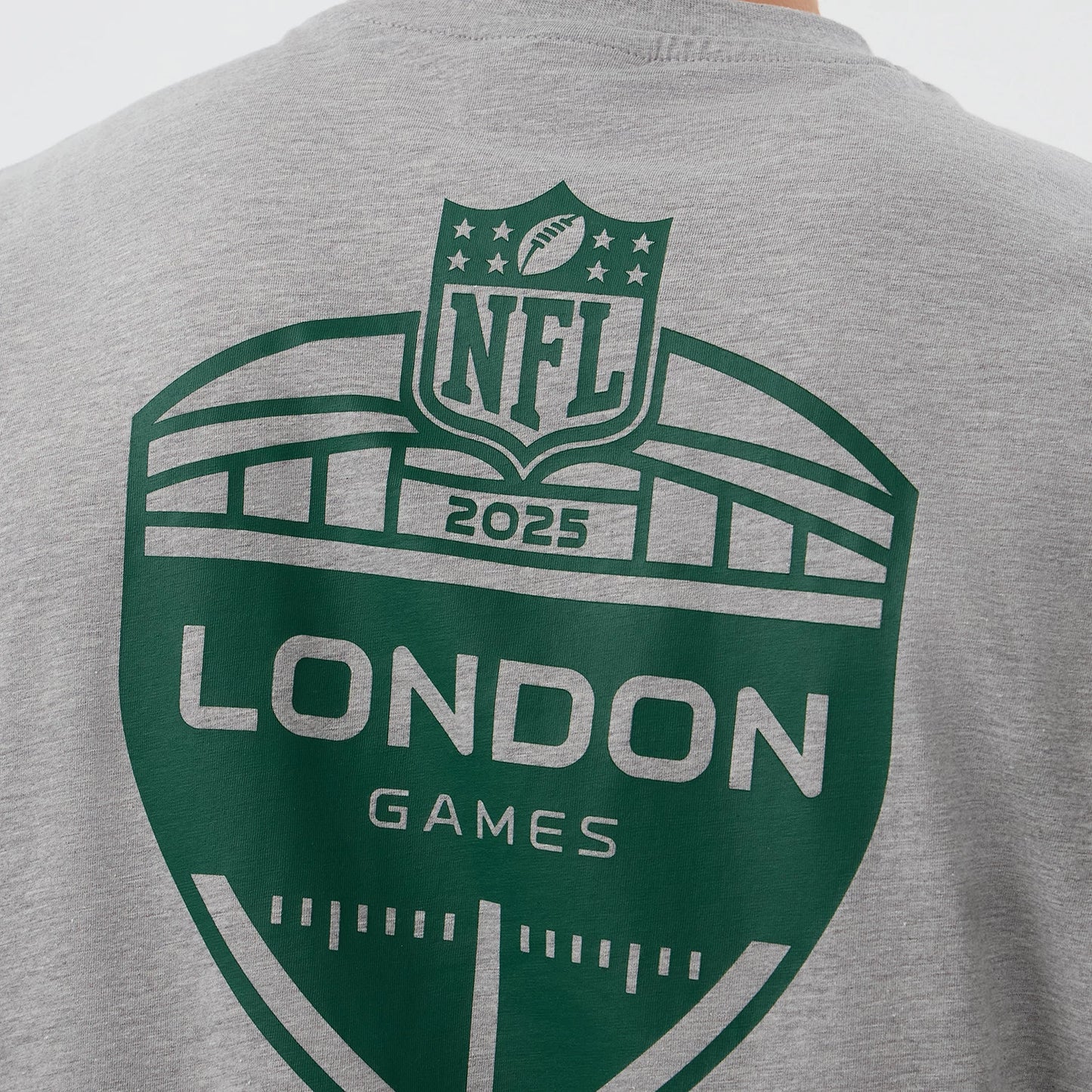 The Male model is wearing New York Jets NFL International Series Games Grey Oversized T-Shirt 4
