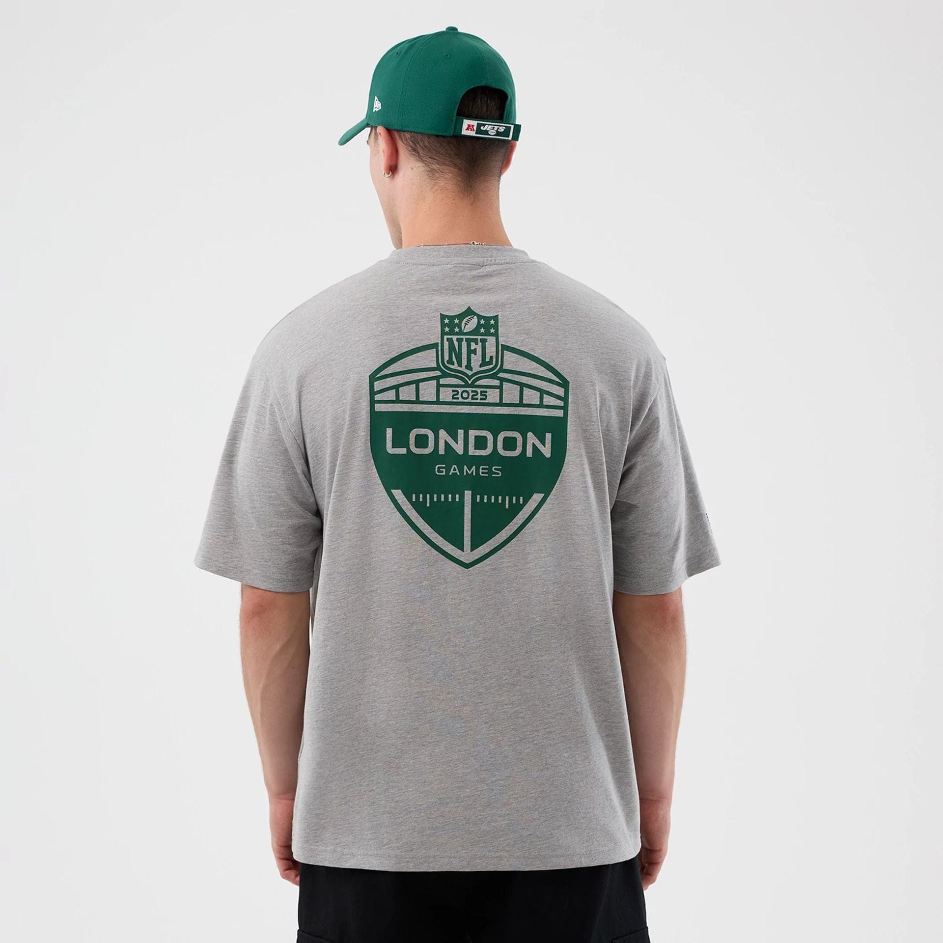 The Male model is wearing New York Jets NFL International Series Games Grey Oversized T-Shirt  2