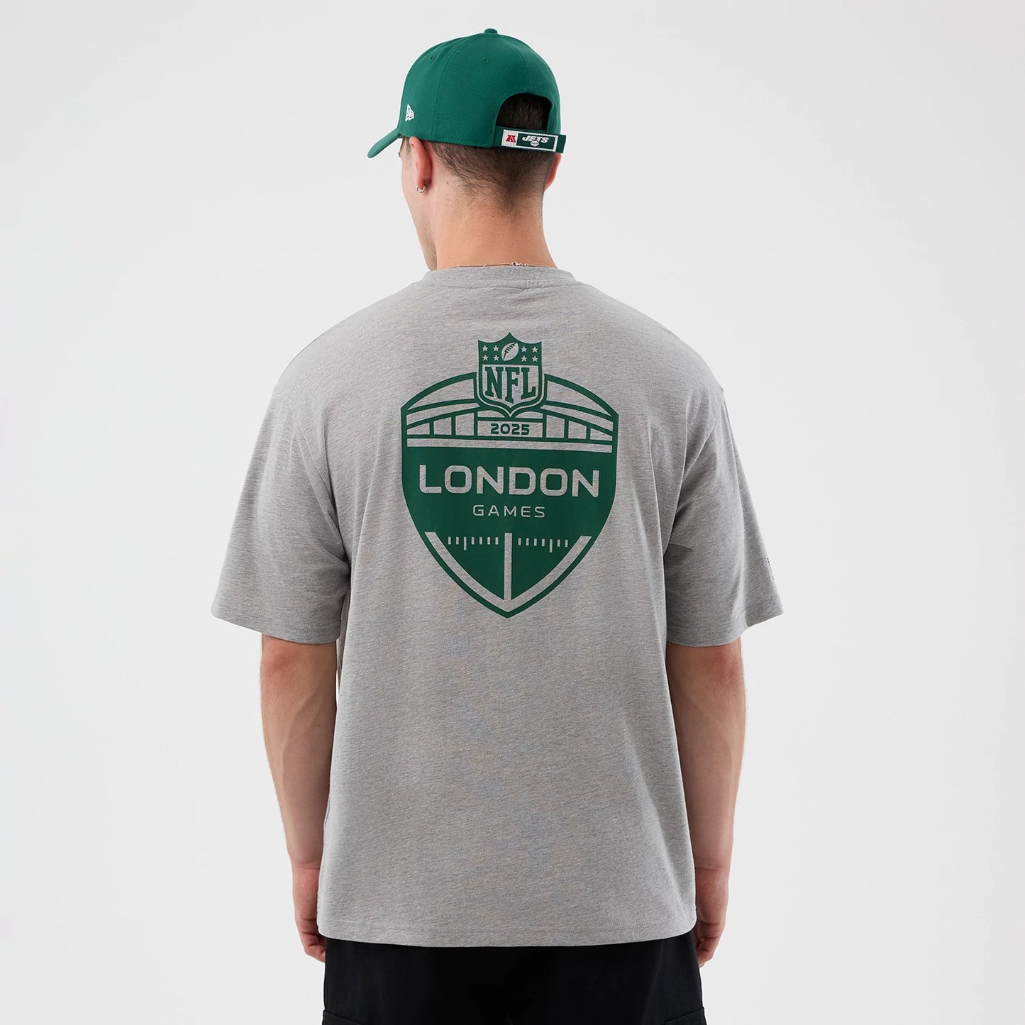 The Male model is wearing New York Jets NFL International Series Games Grey Oversized T-Shirt 2