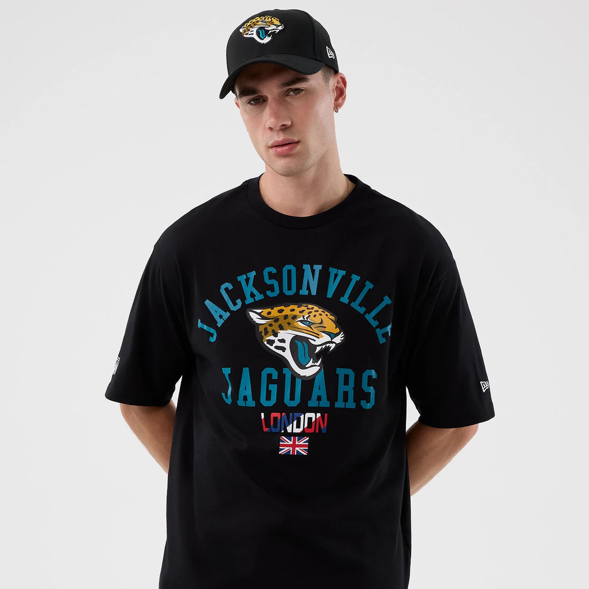 The Male model is wearing Jacksonville Jaguars NFL International Series Games London Black Oversized T-Shirt 7