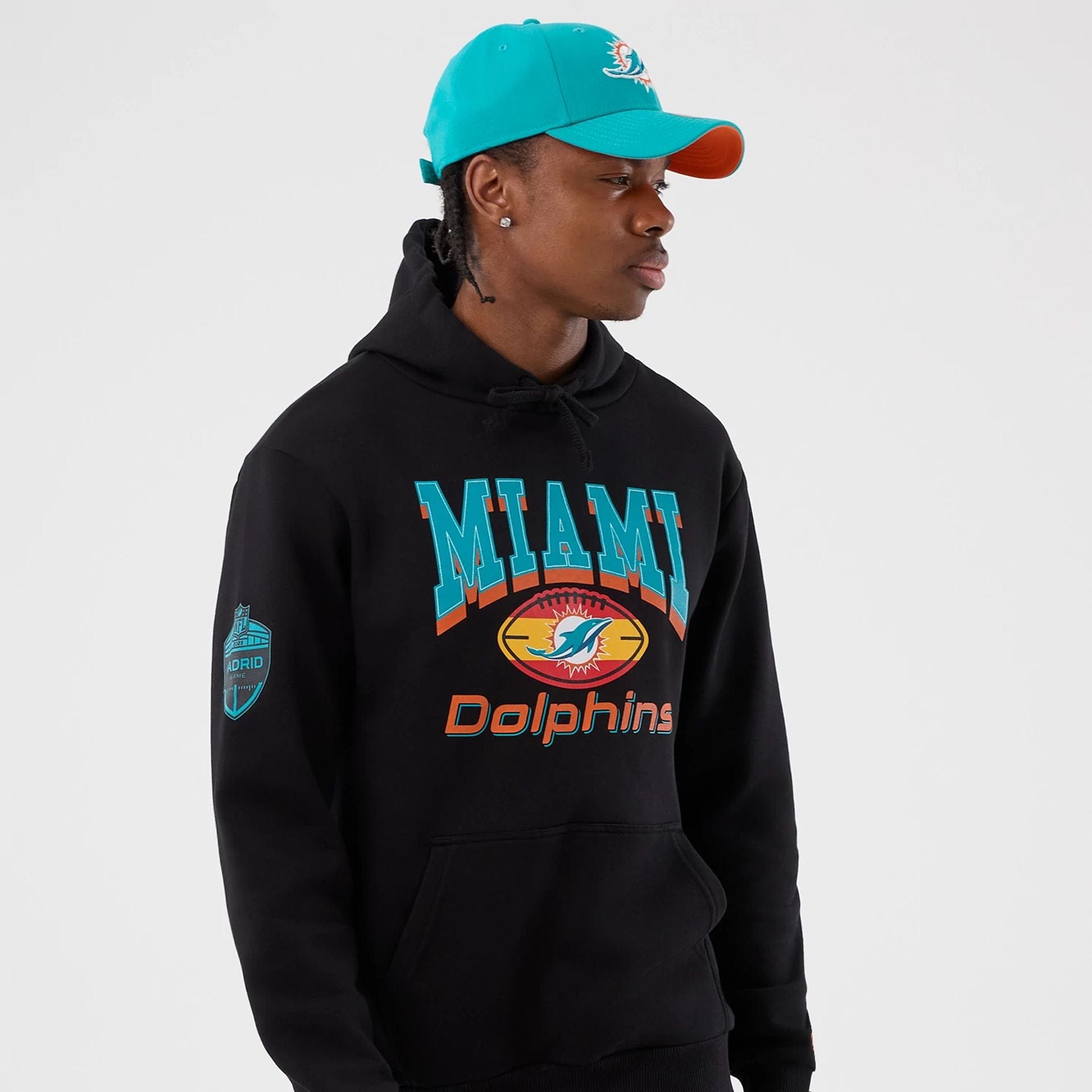 The Male model is wearing Miami Dolphins NFL International Series Games Black Pullover Hoodie  6