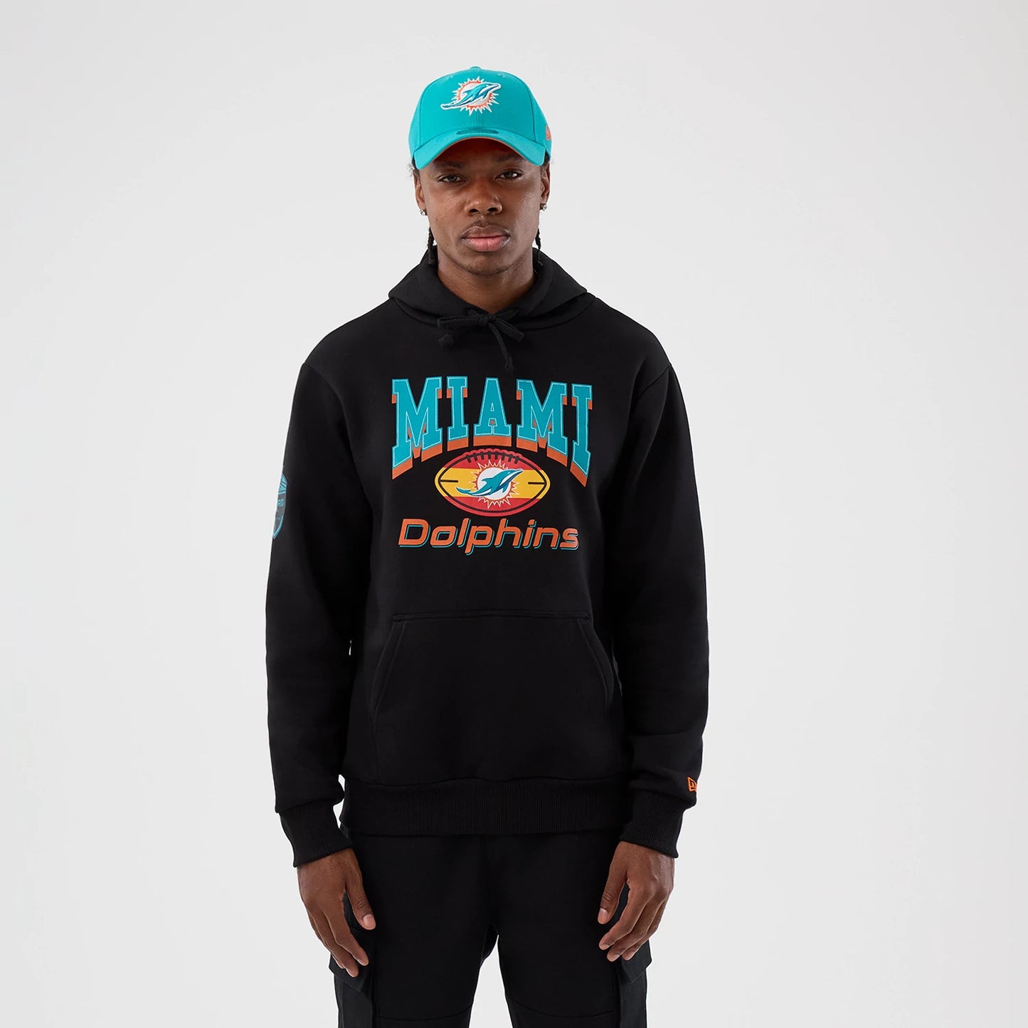 The Male model is wearing Miami Dolphins NFL International Series Games Patch Black Pullover Hoodie 1