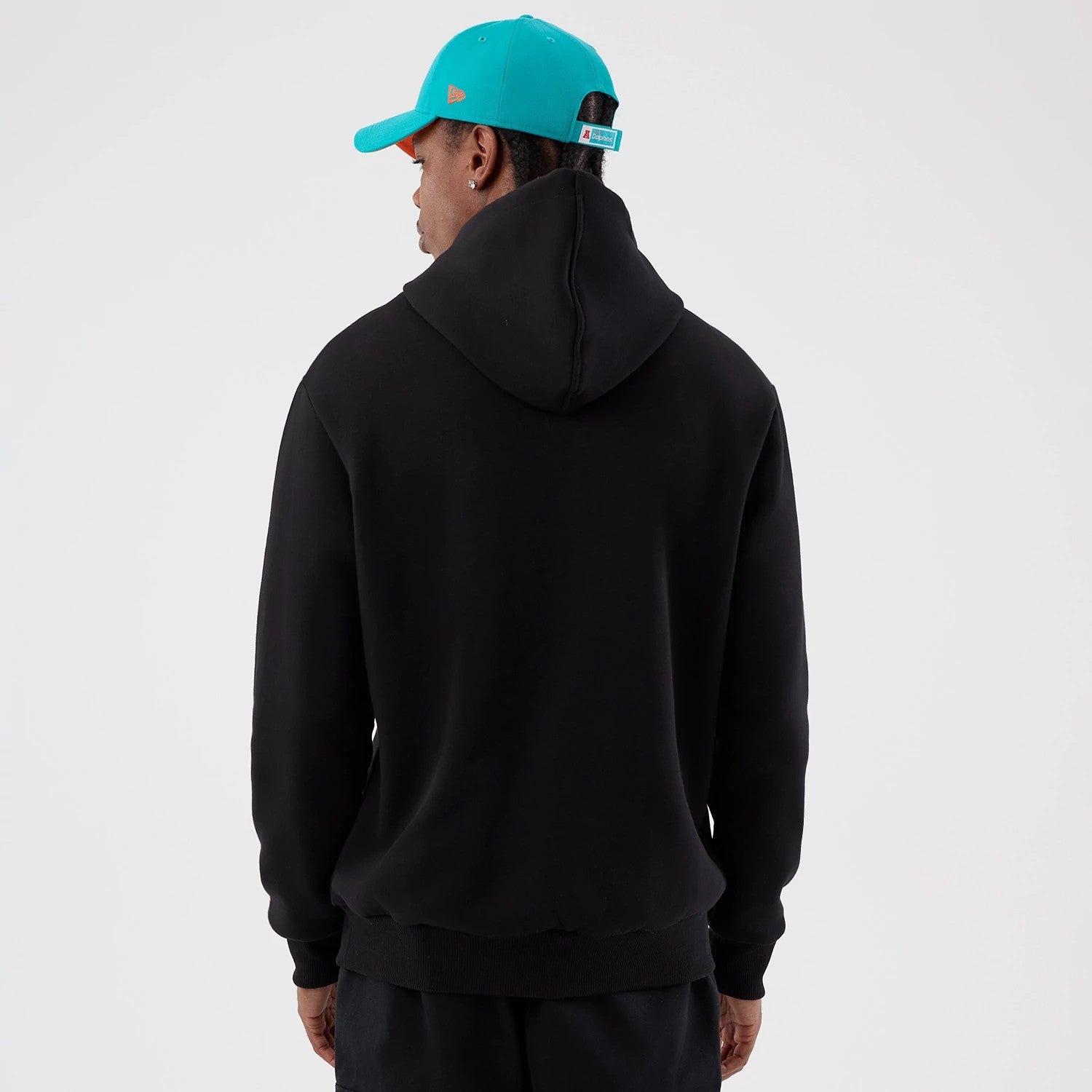 The Male model is wearing Miami Dolphins NFL International Series Games Patch Black Pullover Hoodie 2