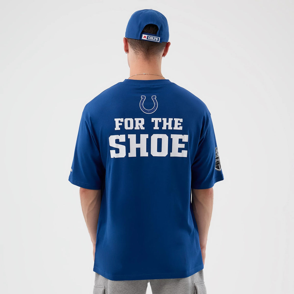 The Male model is wearing Indianapolis Colts NFL International Series Games Script Blue Oversized T-Shirt 2