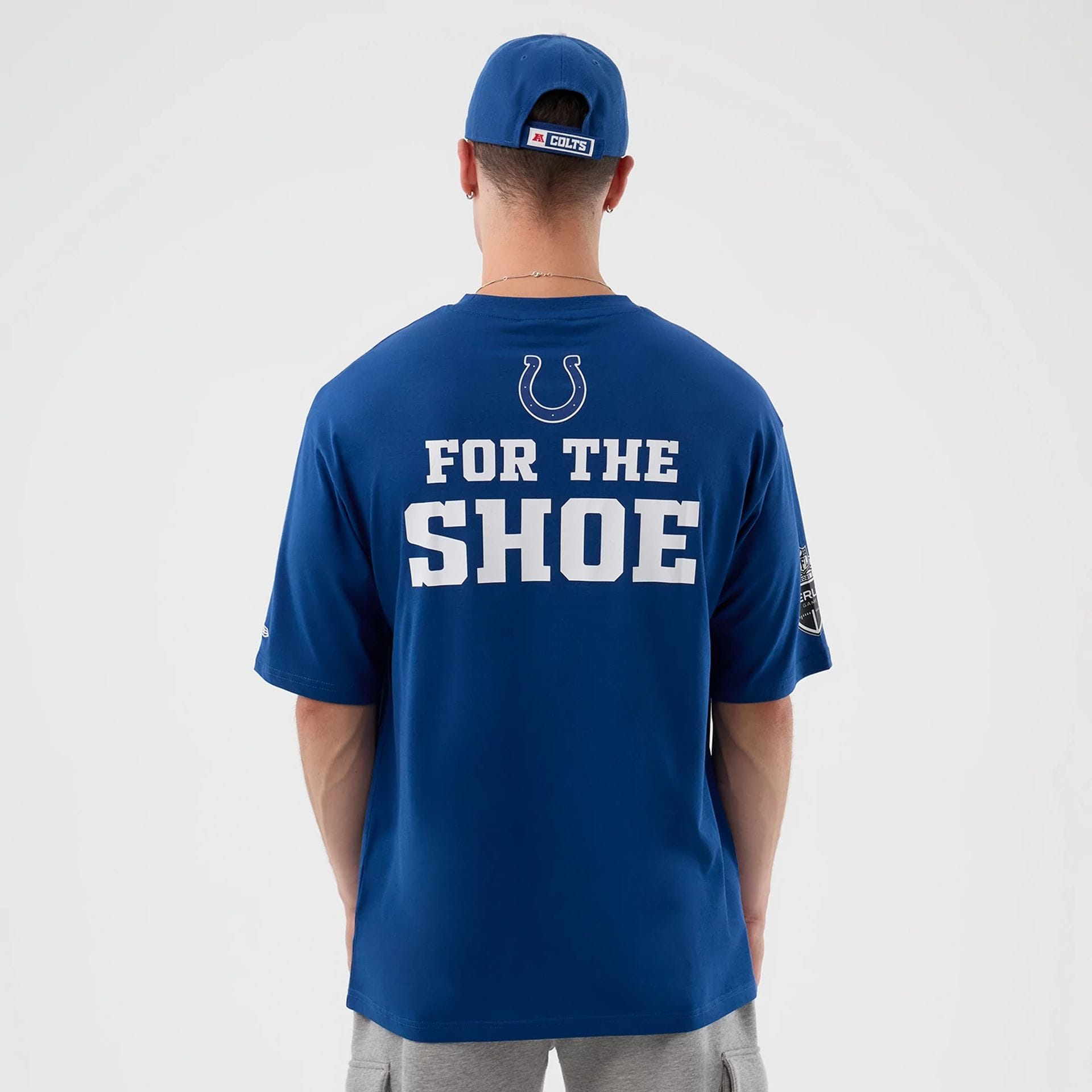 The Male model is wearing Indianapolis Colts NFL International Series Games Blue Oversized T-Shirt 2