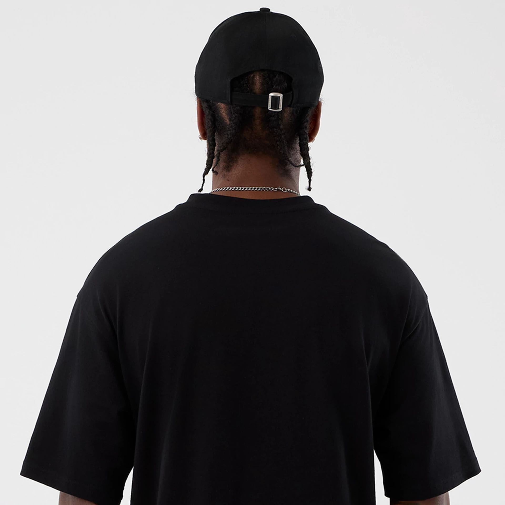 The Male model is wearing Berlin NFL International Series Games Black Oversized T-Shirt 7