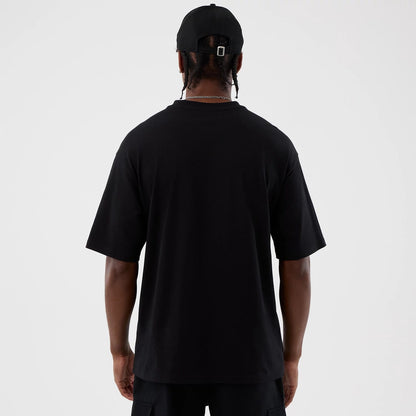 The Male model is wearing Berlin NFL International Series Games Black Oversized T-Shirt 2