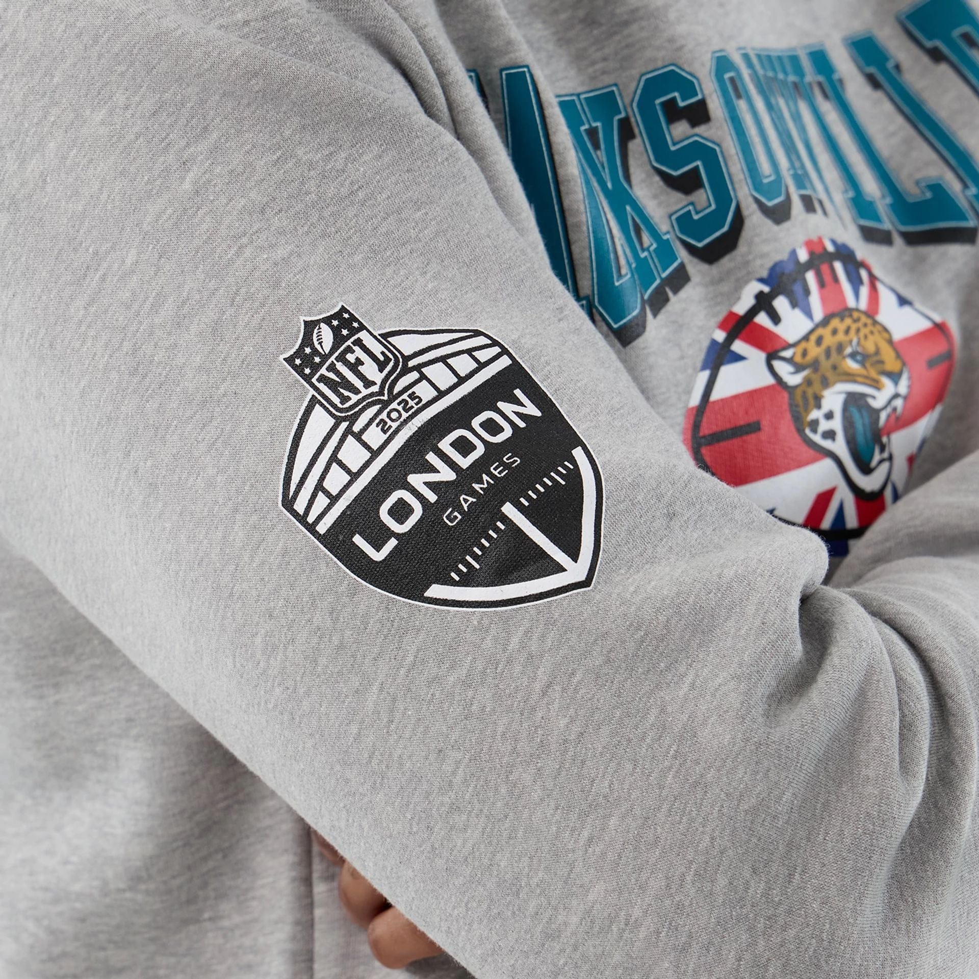 The Male model is wearing Jacksonville Jaguars NFL International Series Games Grey Pullover Hoodie  5