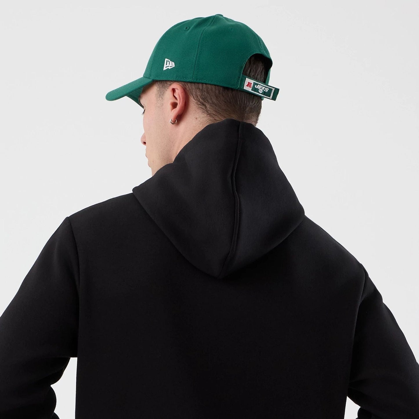 The Male model is wearing New York Jets NFL International Series Games Black Pullover Hoodie  7